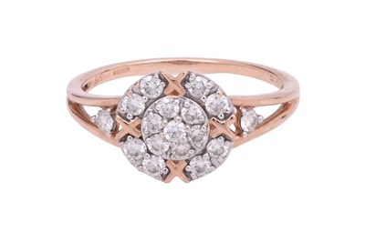 Lot 8 - A DIAMOND-SET ROSE GOLD HALO RING