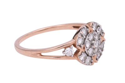 Lot 8 - A DIAMOND-SET ROSE GOLD HALO RING