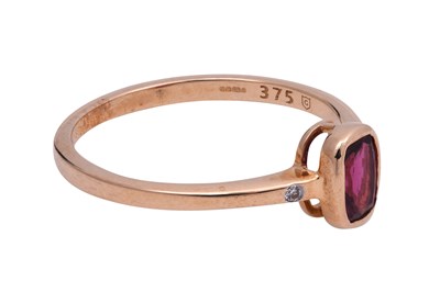 Lot 14 - A RUBELLITE AND ZIRCON-SET YELLOW GOLD RING