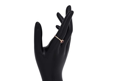 Lot 14 - A RUBELLITE AND ZIRCON-SET YELLOW GOLD RING