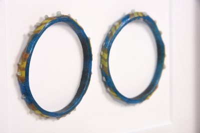 Lot 368 - A PAIR OF EARLY ISLAMIC GLASS BRACELETS