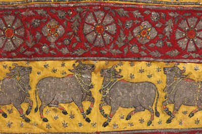 Lot 65 - A DECORATIVE PATCHWORK OF INDIAN PICHHWAI HANGING SECTIONS WITH COWS AND FLOWERS