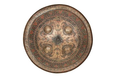 Lot 339 - AN ENGRAVED AND POLYCHROME ENAMELLED KASHMIRI BRASS SHIELD (DHAL)