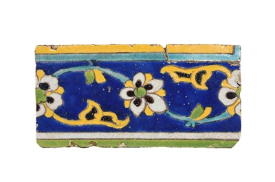 Lot 352 - A SAFAVID CUERDA SECA POTTERY BORDER TILE