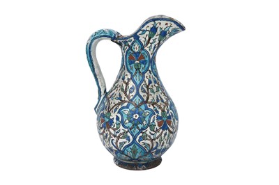Lot 420 - AN ARMENIAN KUTAHYA-STYLE POTTERY WATER JUG