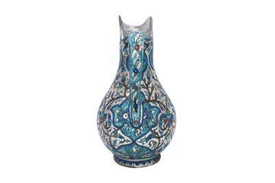 Lot 420 - AN ARMENIAN KUTAHYA-STYLE POTTERY WATER JUG