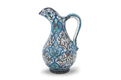 Lot 420 - AN ARMENIAN KUTAHYA-STYLE POTTERY WATER JUG