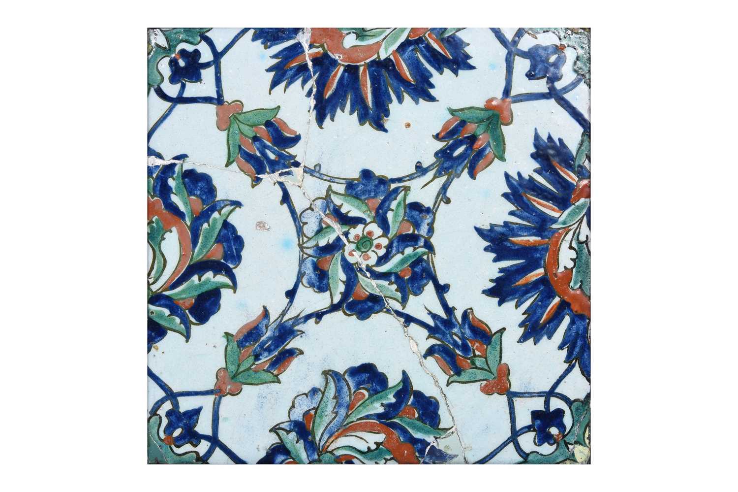 Lot 142 - AN IZNIK POTTERTY TILE WITH FLORAL MOTIFS