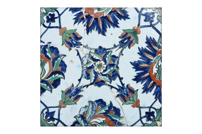 Lot 142 - AN IZNIK POTTERTY TILE WITH FLORAL MOTIFS