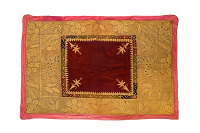 Lot 133 - AN EMBROIDERED CRIMSON RED VELVET MASNAD (FLOOR COVER) WITH TIGERS