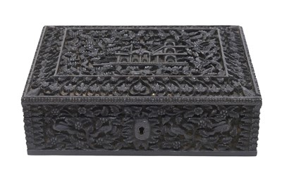 Lot 123 - A DEEPLY CARVED ANGLO-INDIAN EBONY BOX WITH A PALATIAL SETTING AND VEGETATION