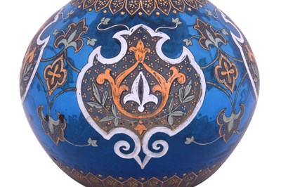 Lot 425 - A POLYCHROME ENAMELLED CLEAR BLUE GLASS HUQQA BASE