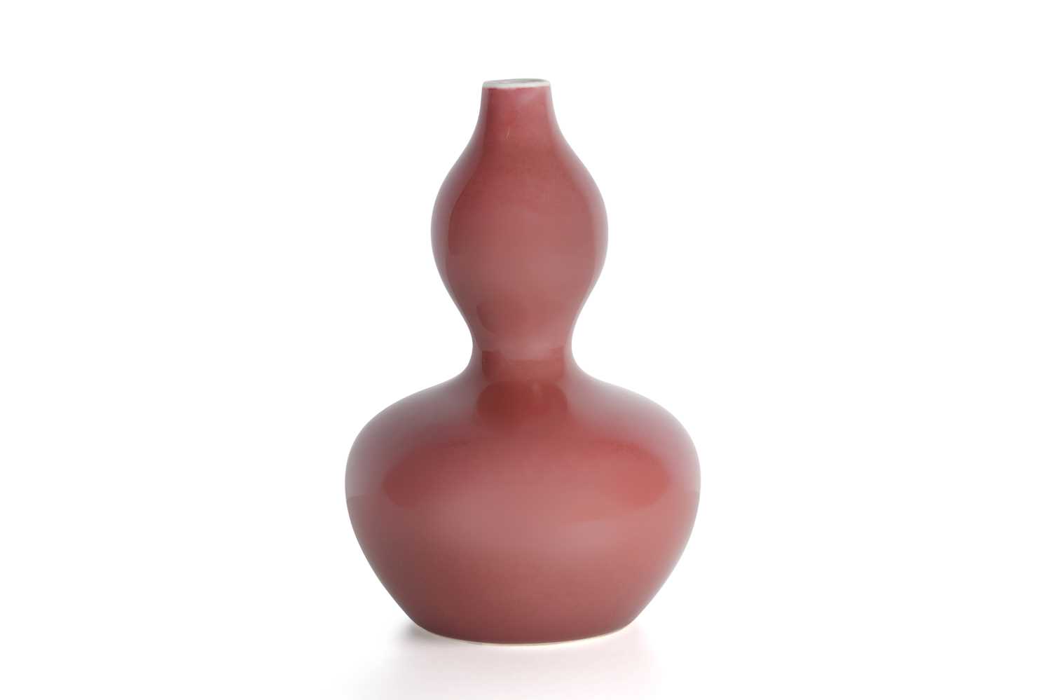 Lot 77 - A CHINESE RED-GLAZED DOUBLE GOURD VASE