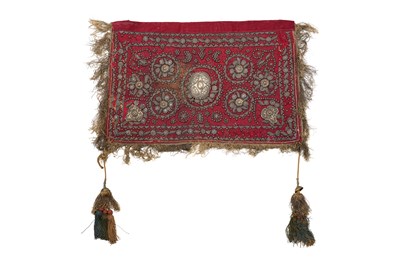 Lot 278 - A SECTION OF A RED VELVET CEREMONIAL SADDLE CLOTH
