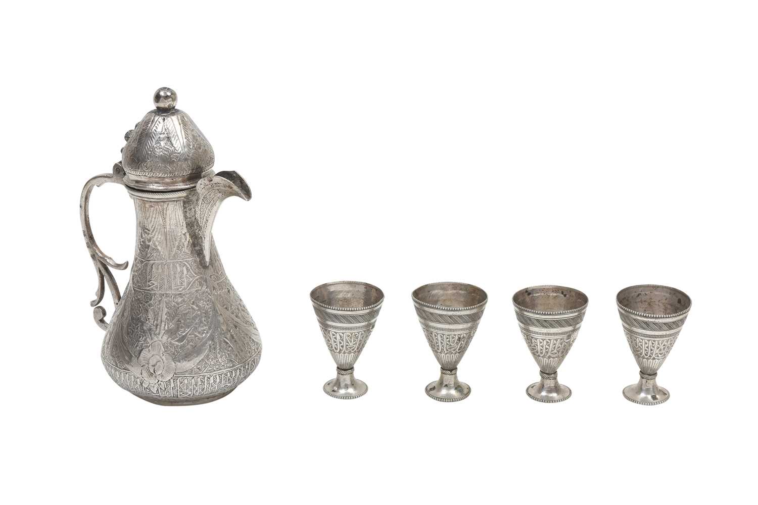 Lot 241 - A CHASED EGYPTIAN SILVER COFFEE POT AND FOUR ENGRAVED SILVER ZARF CUPS