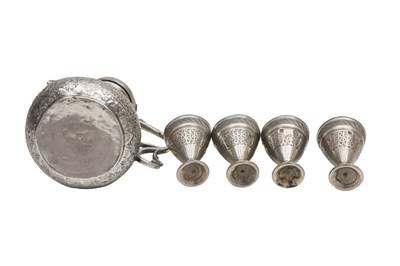 Lot 241 - A CHASED EGYPTIAN SILVER COFFEE POT AND FOUR ENGRAVED SILVER ZARF CUPS