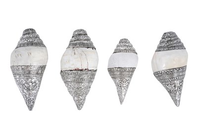 Lot 122 - λ FOUR SILVER-MOUNTED RITUAL SACRED CHANK SHELLS (SHANKHA)