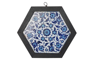 Lot 143 - AN OTTOMAN IZNIK-REVIVAL HEXAGONAL POTTERY TILE