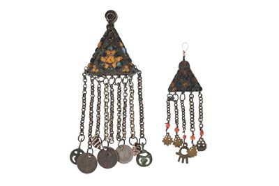 Lot 28 - TWO TUNISIAN POLYCHROME ENAMELLED TRIANGULAR SILVER PENDANTS WITH TALISMANIC CHARMS