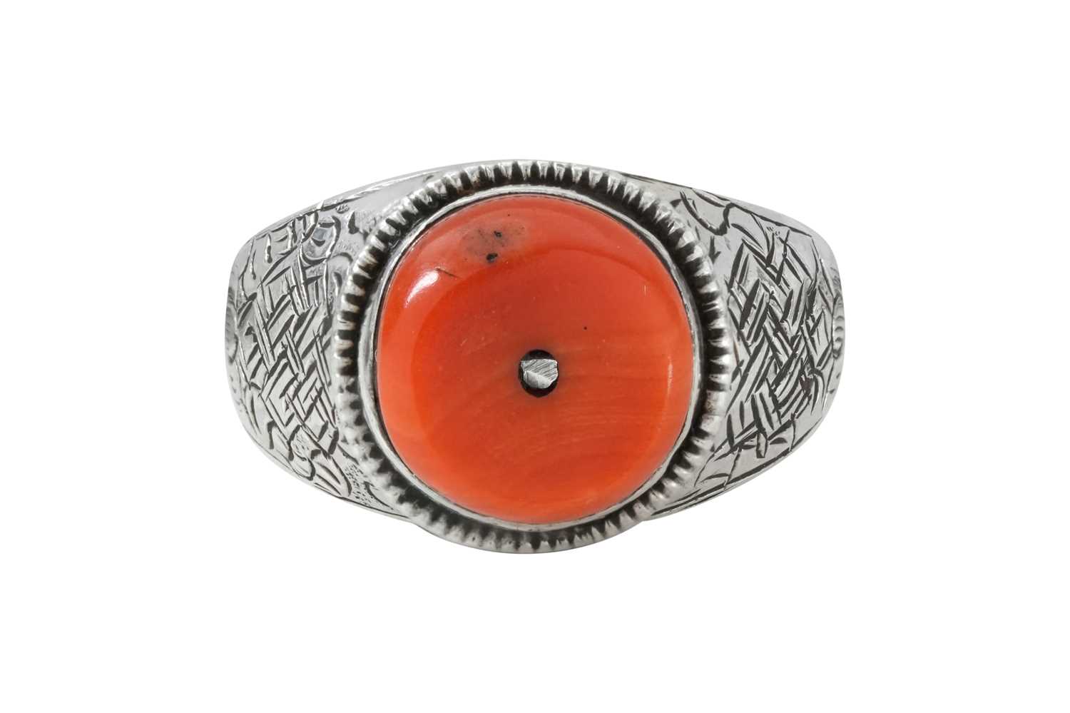 Lot 127 - A TIBETAN BUDDHIST CORAL-SET SILVER RING WITH ENDLESS KNOT MOTIF