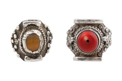 Lot 128 - TWO TIBETAN 'SADDLE' SILVER RINGS (TAGAM)
