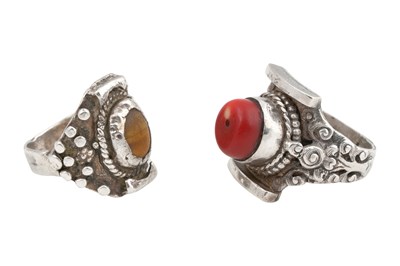 Lot 128 - TWO TIBETAN 'SADDLE' SILVER RINGS (TAGAM)