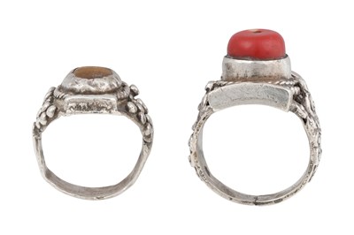 Lot 128 - TWO TIBETAN 'SADDLE' SILVER RINGS (TAGAM)