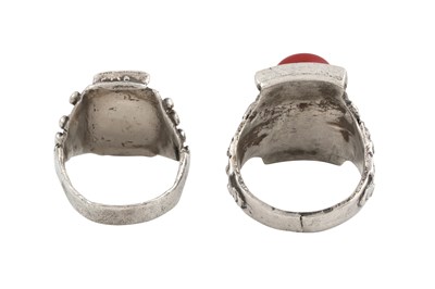 Lot 128 - TWO TIBETAN 'SADDLE' SILVER RINGS (TAGAM)