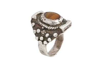 Lot 128 - TWO TIBETAN 'SADDLE' SILVER RINGS (TAGAM)