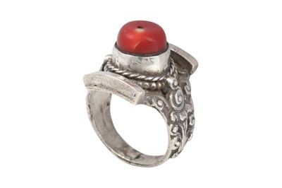 Lot 128 - TWO TIBETAN 'SADDLE' SILVER RINGS (TAGAM)