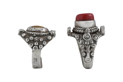 Lot 128 - TWO TIBETAN 'SADDLE' SILVER RINGS (TAGAM)