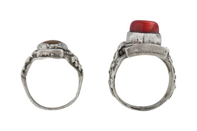 Lot 128 - TWO TIBETAN 'SADDLE' SILVER RINGS (TAGAM)