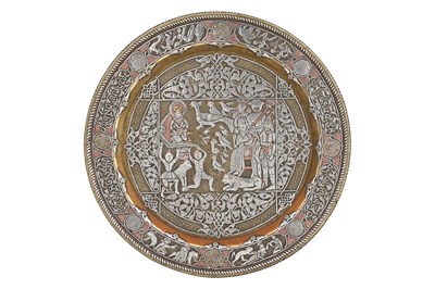 Lot 197 - A DAMASCUS-WARE SILVER AND COPPER-INLAID BRASS FIGURAL DISH WITH ENTHRONED KING SOLOMON