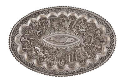 Lot 229 - AN INDIAN REPOUSSÉ SILVER SERVING TRAY WITH FISH