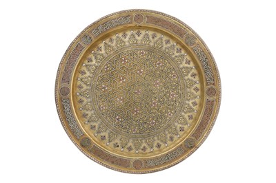 Lot 196 - A DAMASCUS-WARE SILVER AND COPPER-INLAID BRASS DISH WITH STELLAR AND FLORAL DECORATION