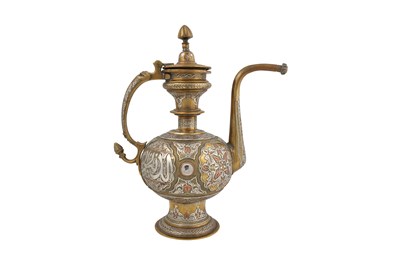 Lot 34 - A MAMLUK-REVIVAL CAIROWARE SILVER AND COPPER-INLAID BRASS EWER