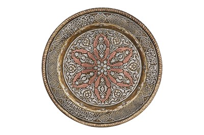 Lot 32 - A MAMLUK-REVIVAL CAIROWARE SILVER AND COPPER-INLAID BRASS DISH WITH FISH