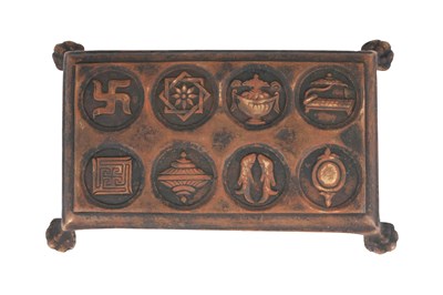 Lot 121 - A BUDDHIST CAST BRONZE RITUAL STAND WITH THE ASHTAMANGALA (EIGHT AUSPICIOUS SYMBOLS)