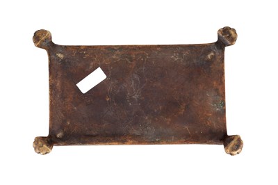 Lot 121 - A BUDDHIST CAST BRONZE RITUAL STAND WITH THE ASHTAMANGALA (EIGHT AUSPICIOUS SYMBOLS)