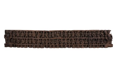 Lot 180 - A CARVED ARCHITECTURAL WOODEN PANEL WITH DEITIES AND DANCING FIGURES