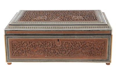 Lot 159 - λ AN INDIAN CARVED SANDALWOOD BOX WITH JUNGLE SCENE AND SADELI-STYLE BORDERS