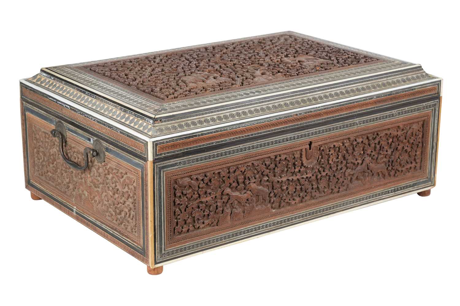 Lot 159 - λ AN INDIAN CARVED SANDALWOOD BOX WITH JUNGLE SCENE AND SADELI-STYLE BORDERS