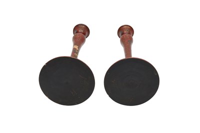 Lot 204 - A PAIR OF SAFAVID-REVIVAL IMAMI-STYLE LACQUERED WOODEN CANDLESTICKS