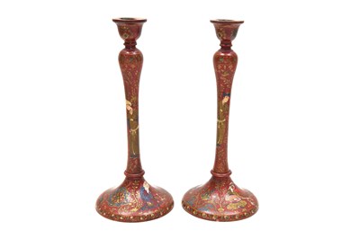 Lot 204 - A PAIR OF SAFAVID-REVIVAL IMAMI-STYLE LACQUERED WOODEN CANDLESTICKS