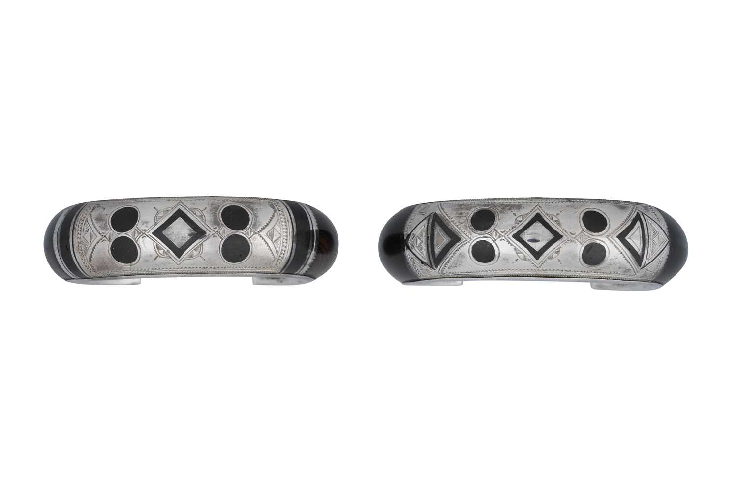 Lot 7 - A NEAR PAIR OF SIGNED TUAREG DARK WOOD AND SILVER BANGLES