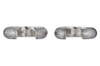 Lot 7 - A NEAR PAIR OF SIGNED TUAREG DARK WOOD AND SILVER BANGLES