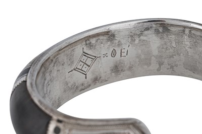 Lot 7 - A NEAR PAIR OF SIGNED TUAREG DARK WOOD AND SILVER BANGLES