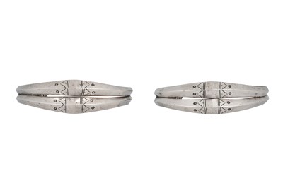 Lot 12 - A PAIR OF SPANISH SAHARAN SILVER BANGLES WITH FLORAL MOTIFS