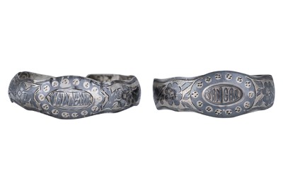 Lot 74 - TWO CIRCASSIAN NIELLO AND SILVER SHEET BANGLES WITH FLOWER MOTIFS