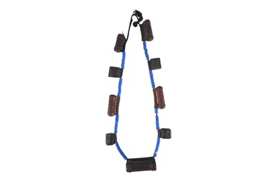 Lot 1 - AN ETHIOPIAN LAPIS LAZULI BEAD NECKLACE WITH LEATHER AMULET HOLDERS (HIRZ)